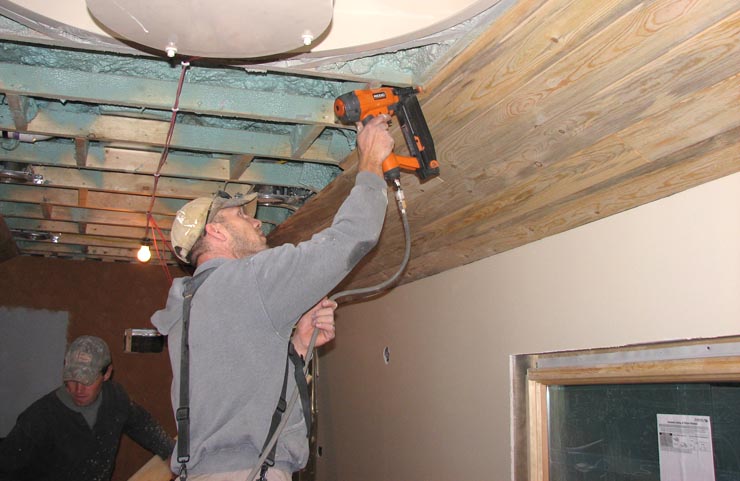 Nailing the blue pine ceiling